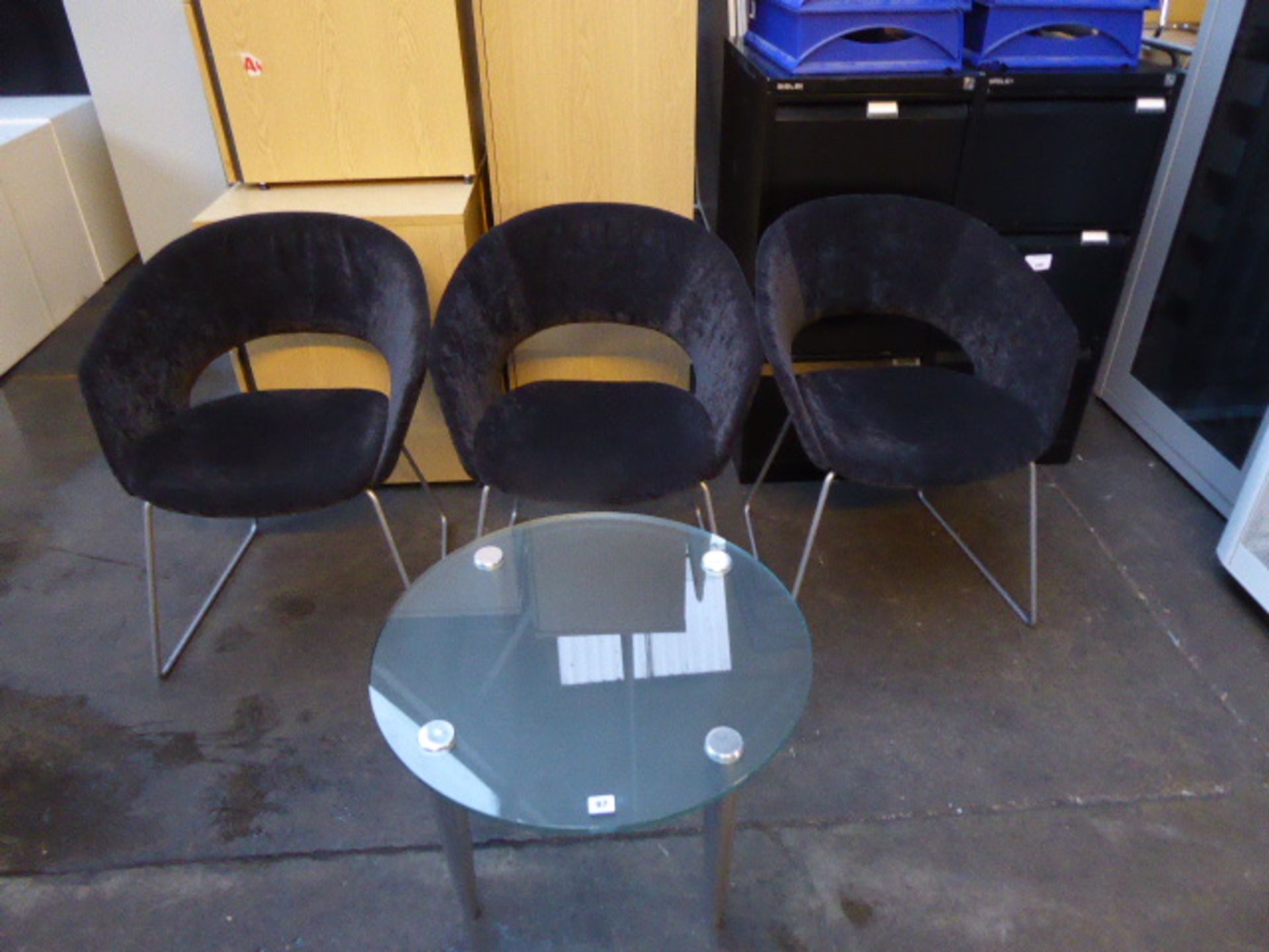 3 Verco black cloth reception chairs and a heavy glass coffee table