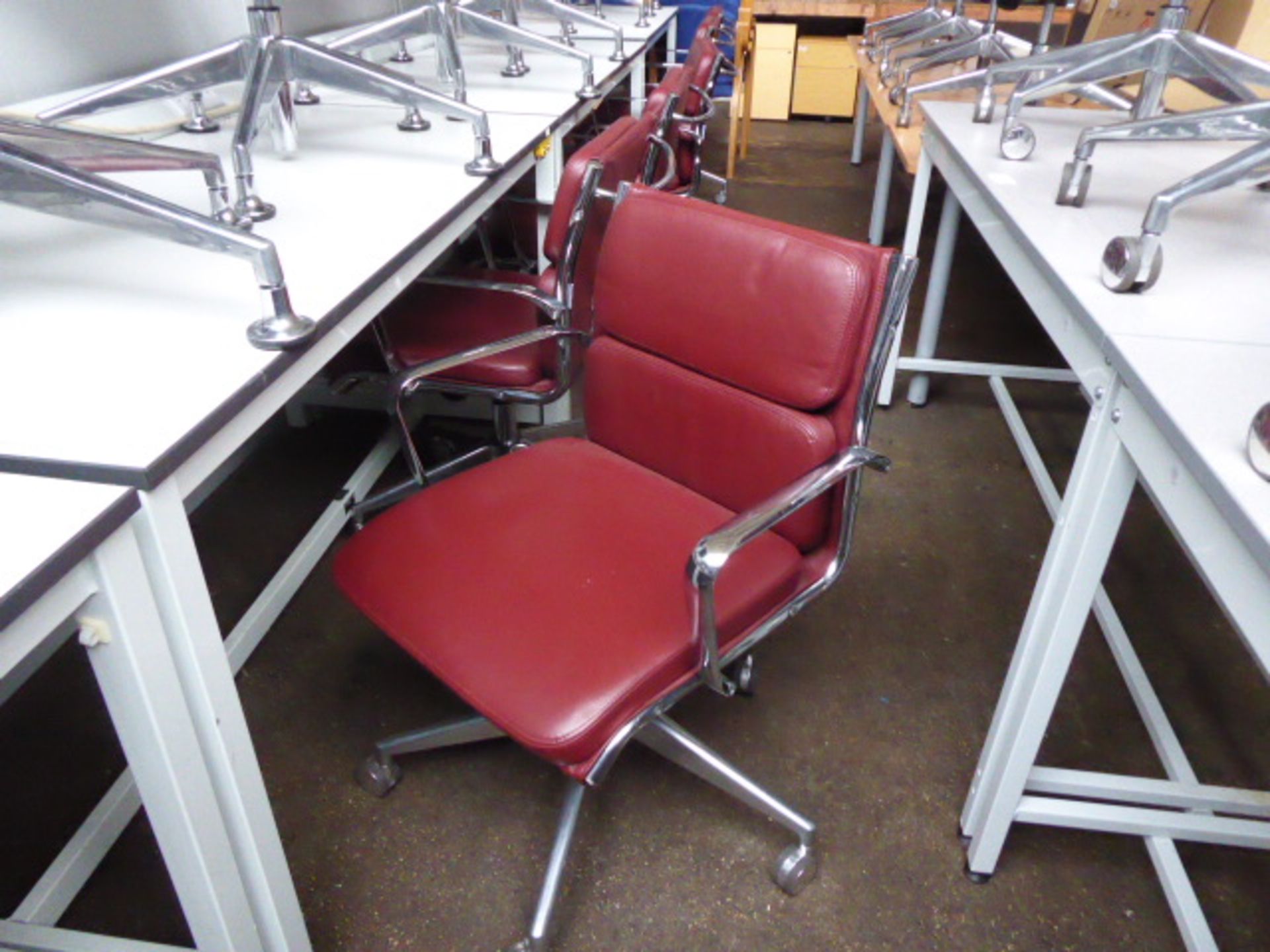 6 Milani Charles Eames style soft pad swivel armchairs in burgundy leather with higher lift action