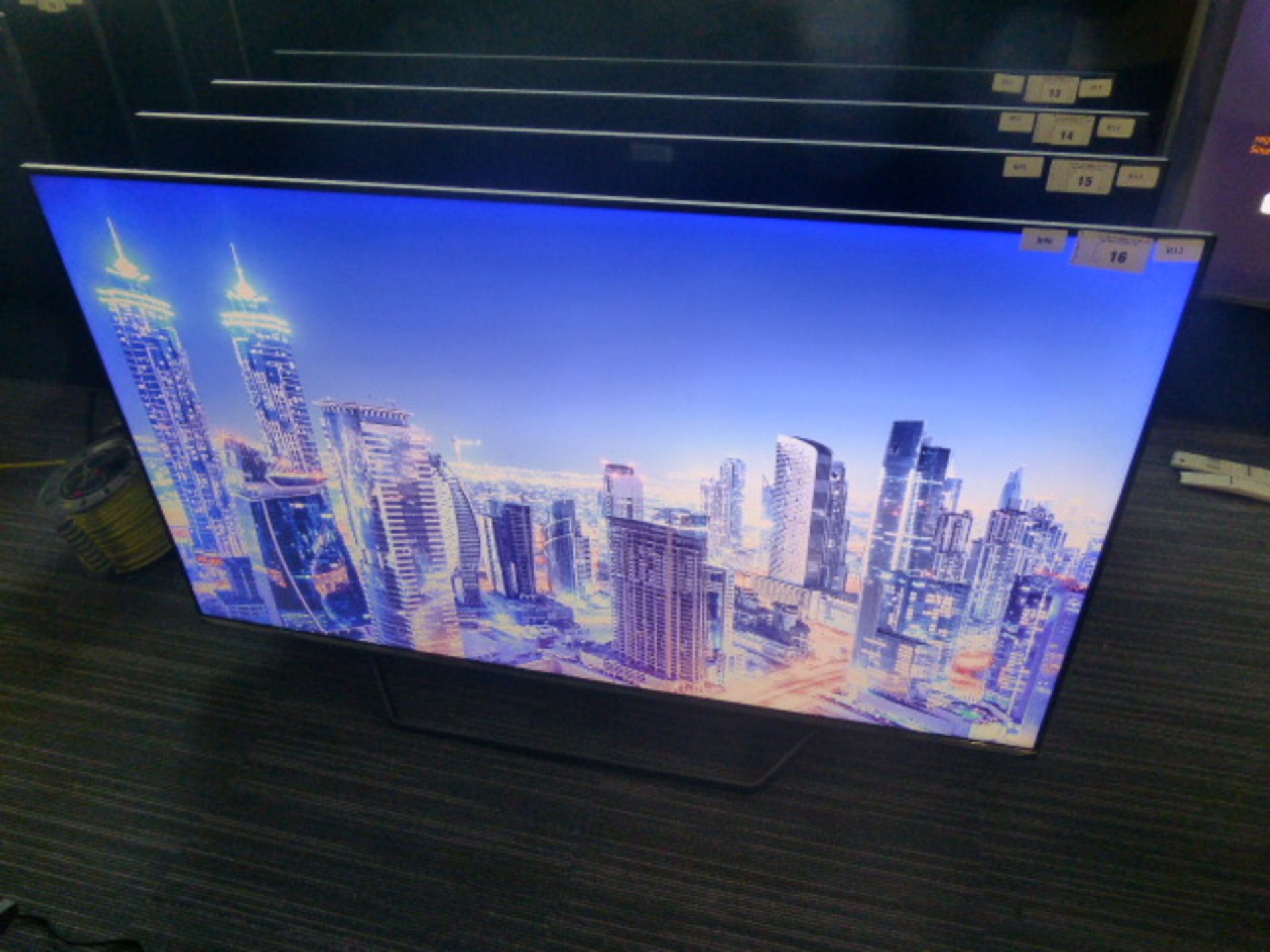 R12, 55'' Hisense 4K UHD TV, model 55U7QFTUK, to include box no. B90