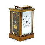 A late 19th/early 20th century carriage clock, the movement striking on a gon,
