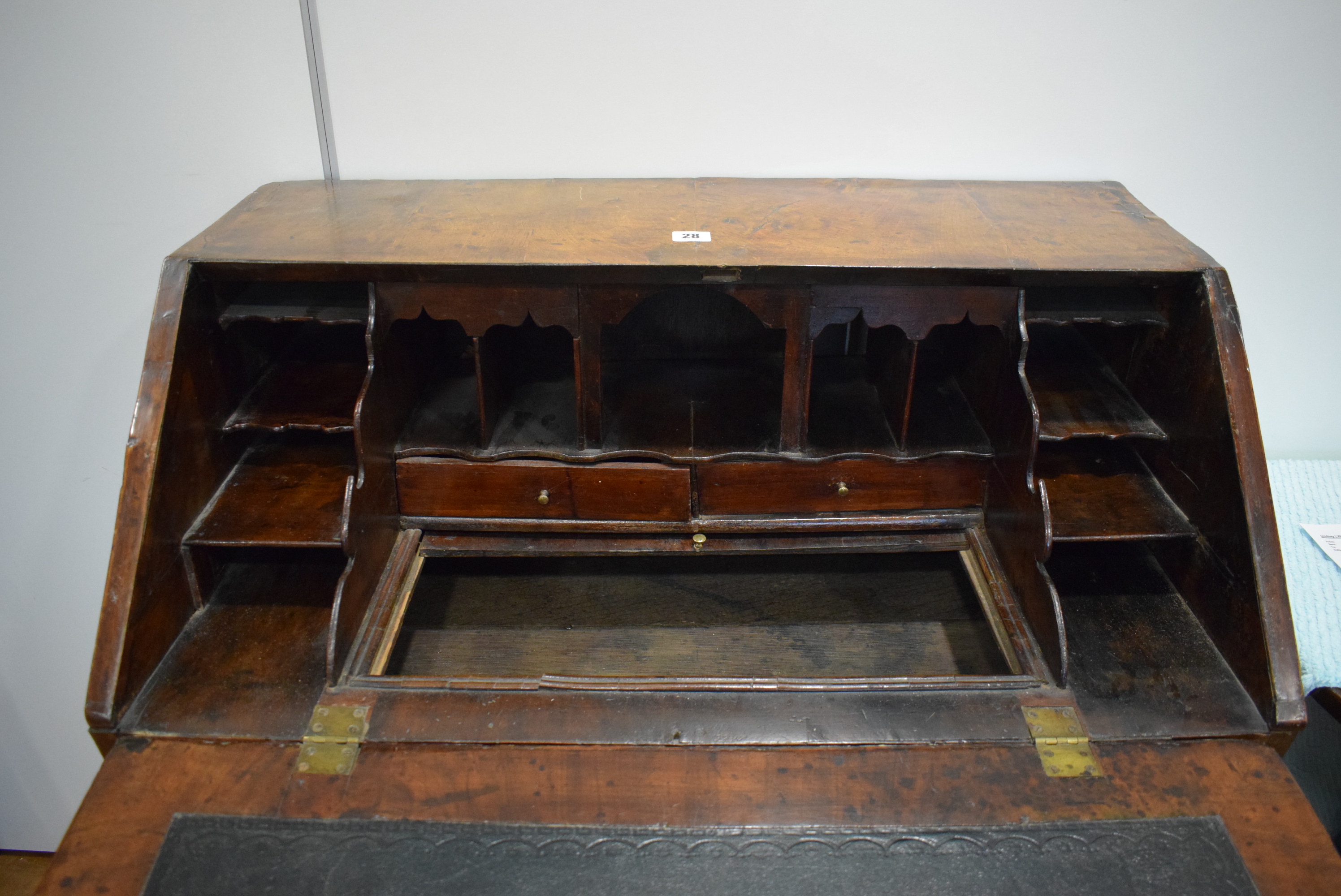 A George I/II walnut and feather crossbanded bureau, the fall front enclosing a fitted interior, - Image 29 of 55