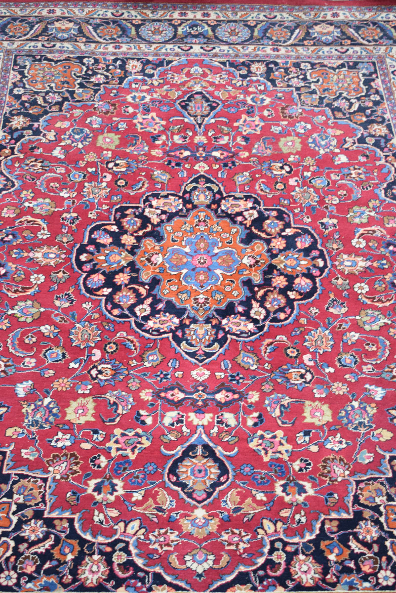 An Iranian carpet, the blue and floral ground within matching bands, - Image 2 of 7