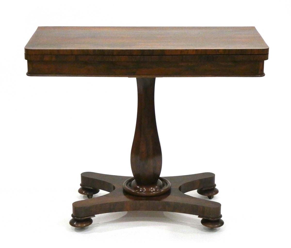 A Regency/William IV rosewood card table on a turned column with a platform base and bun feet, w.