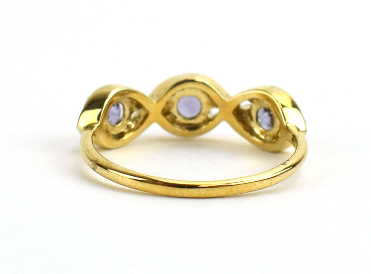 A 9ct yellow gold ring set three blue spinel and white zircon in oval settings by Jacques Christie, - Image 3 of 3