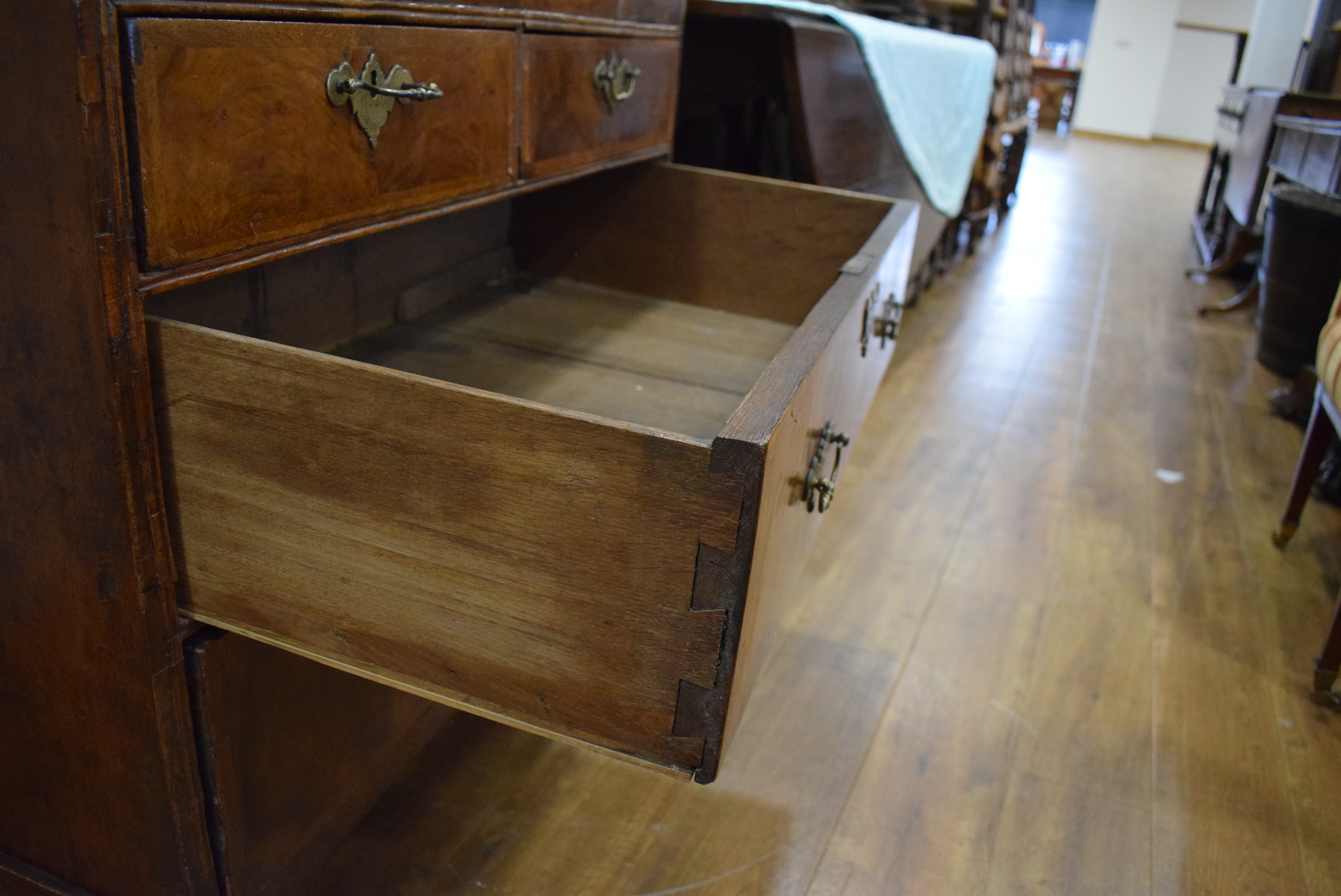 A George I/II walnut and feather crossbanded bureau, the fall front enclosing a fitted interior, - Image 55 of 55