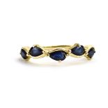 A 9ct yellow gold ring set five teardrop sapphires in an inline setting by Jacques Christie,