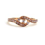 A 9ct rose gold ring set small pale pink diamonds in a crossover setting, ring size S, 2.