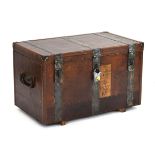 A 19th century metal bound trunk with leatherwork and brass studwork, the interior painted green,