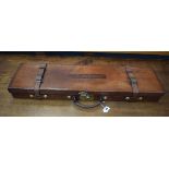 A tan leather and brass mounted gun case, inscribed V. Cobden, l.