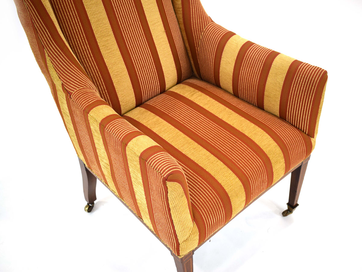 An Edwardian and later upholstered armchair with mahogany strung tapering legs on castors - Image 2 of 2