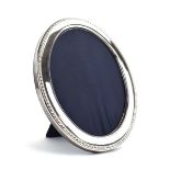 A late 20th century silver easel back photograph frame of oval form, Carrs, Sheffield 1996, h.