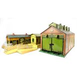 A Hornby O gauge tinplate double engine shed, a turntable,