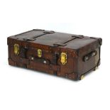 A late 19th century tan leather and brass mounted luggage case/trunk,