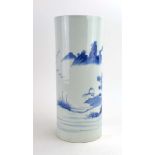 A Chinese blue and white brush pot of cylindrical form, decorated with a traditional landscape, h.