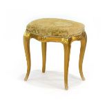 A giltwood and upholstered stool with cabriole legs and a serpentine seat, w.