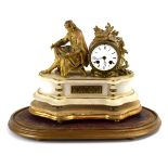 A late 19th century French mantle clock, the onyx case surmounted by a gilt spelter figure,