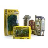 A quantity of OO gauge accessories including scenery, card buildings,