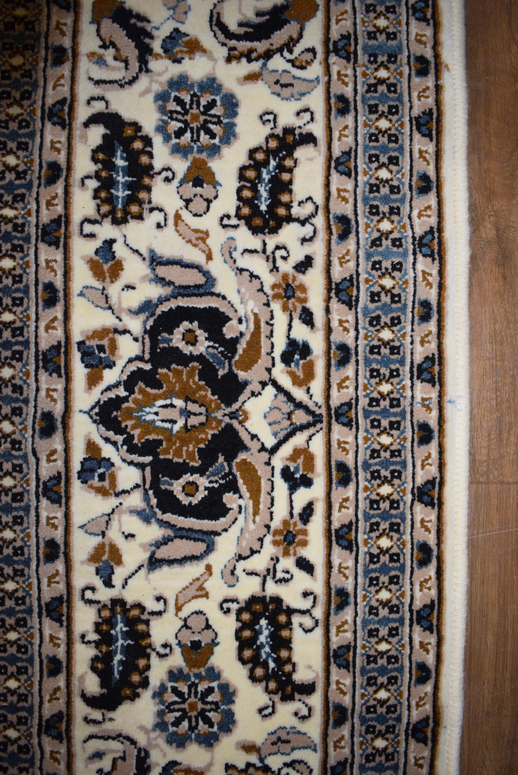 An Iranian carpet, the beige and blue ground with repeated diamond motifs, - Image 6 of 8