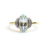 A 9ct yellow gold ring set marquise aquamarine and white zircon by Jacques Christie,