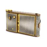 A gilt brass and enamelled musical compact in the form of a vintage camera