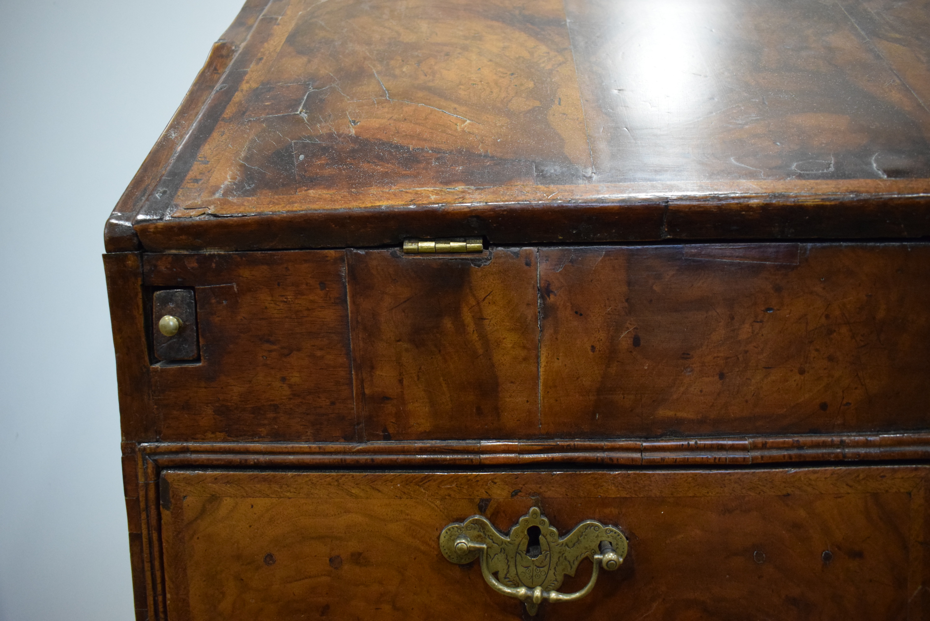 A George I/II walnut and feather crossbanded bureau, the fall front enclosing a fitted interior, - Image 22 of 55