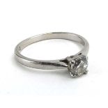 A platinum ring set brilliant cut diamond in a four claw setting, stone approximately 0.