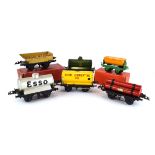 Fifteen Hornby O gauge tankers and tipping wagons,