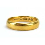 An Edwardian 22ct yellow gold wedding band, Chester 1904, band w.