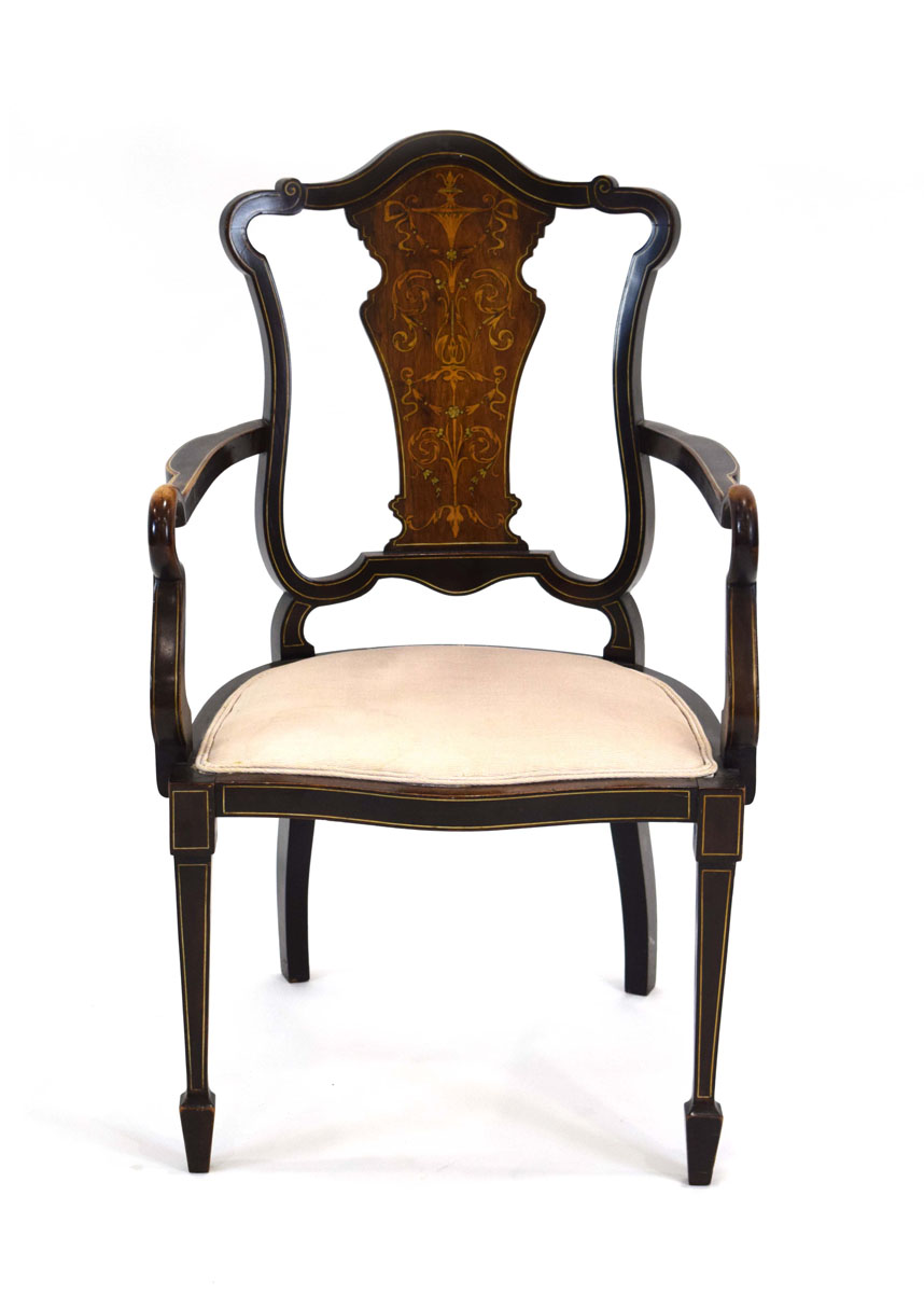 A late 19th century mahogany parlour armchair with a rosewood and marquetry splat,