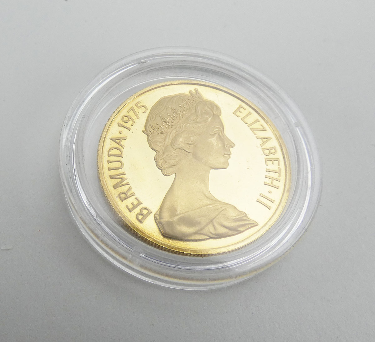A 22ct yellow gold $100 coin commemorating the Royal visit to Bermuda in 1975, - Image 2 of 2