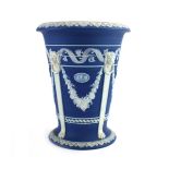 A 19th century Wedgwood jasperware monopodia vase of flared form typically decorated in the