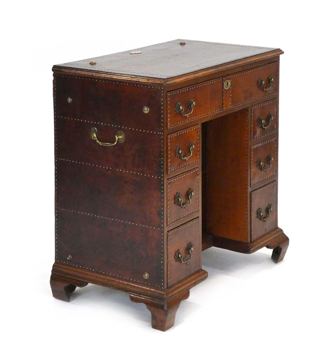 A Georgian mahogany knee-hole desk covered in leather with brass studwork and handles, on ogee feet, - Image 5 of 5