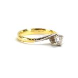 An 18ct yellow gold and platinum highlighted ring set brilliant cut diamond in a four claw