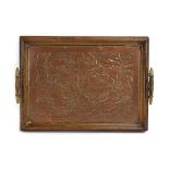A Keswick School of Art tray with a copper centre relief decorated with flowering shrubs, w.