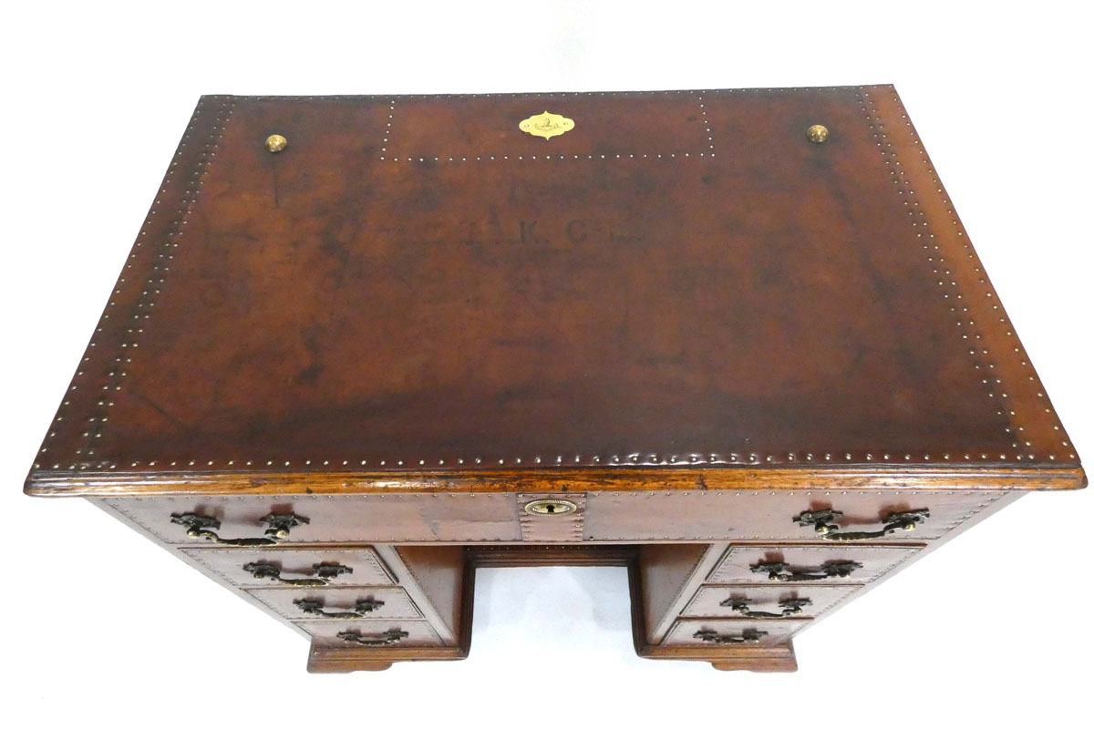 A Georgian mahogany knee-hole desk covered in leather with brass studwork and handles, on ogee feet, - Image 2 of 5