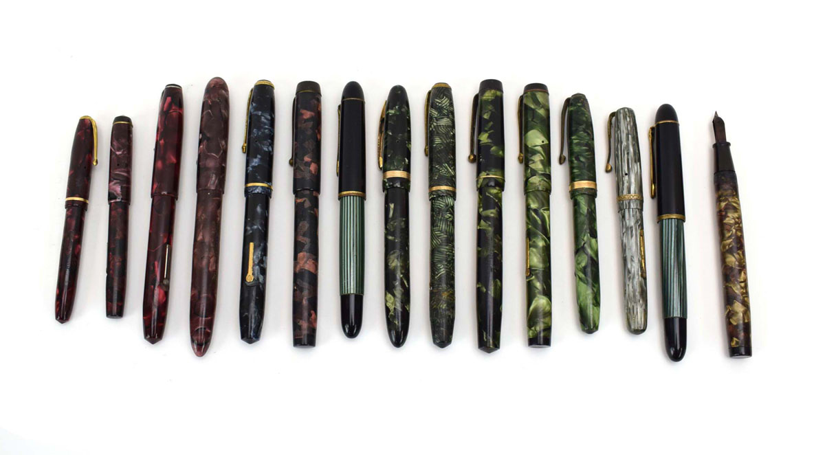 A group of fifteen fountain pens with marbled cases and 14ct gold nibs CONDITION REPORT: