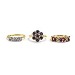 An early 20th century 18ct yellow gold ring set three small diamonds in illusion settings,