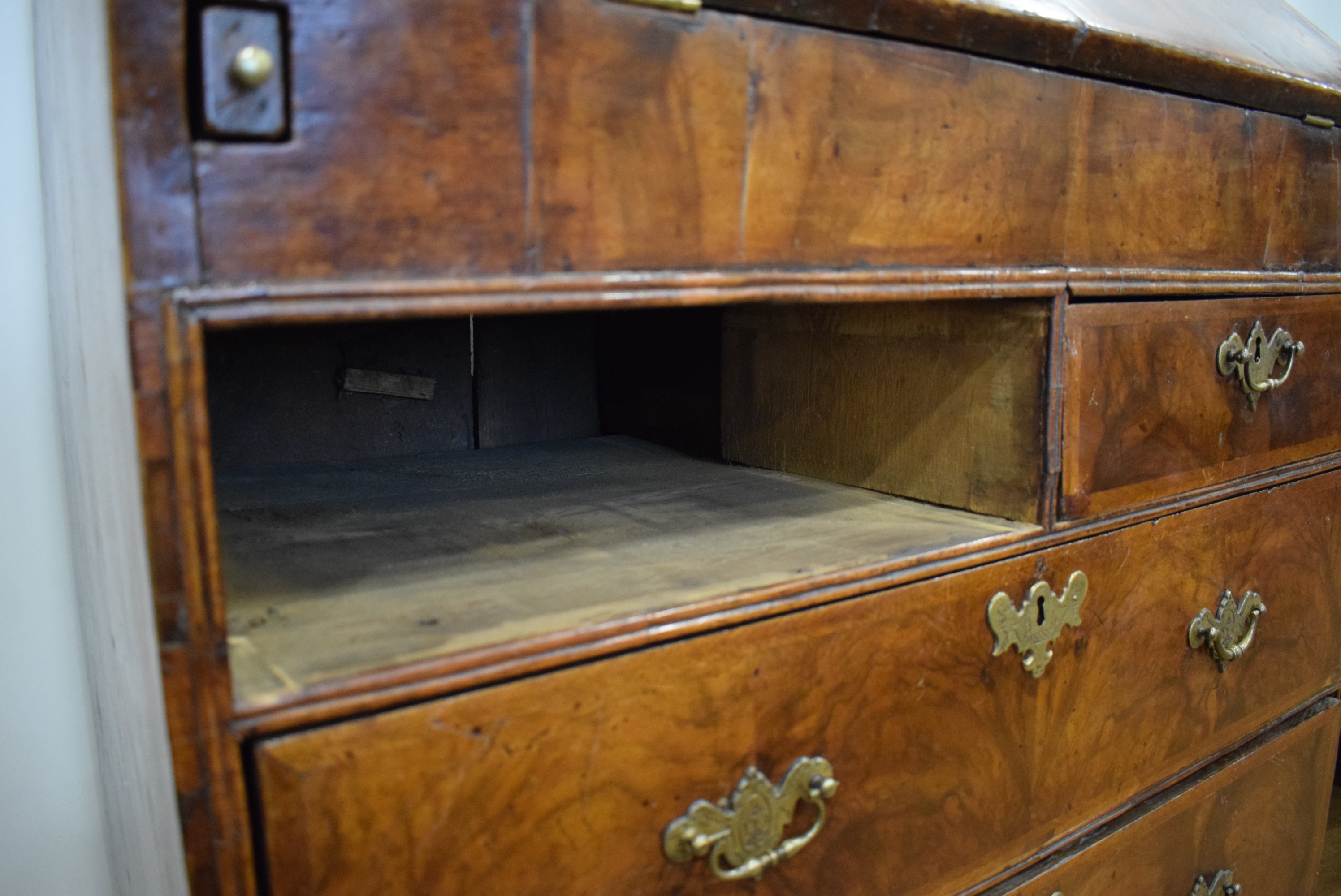 A George I/II walnut and feather crossbanded bureau, the fall front enclosing a fitted interior, - Image 54 of 55