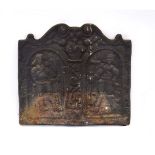 A cast iron fireback, the two panels modelled as classical knights,