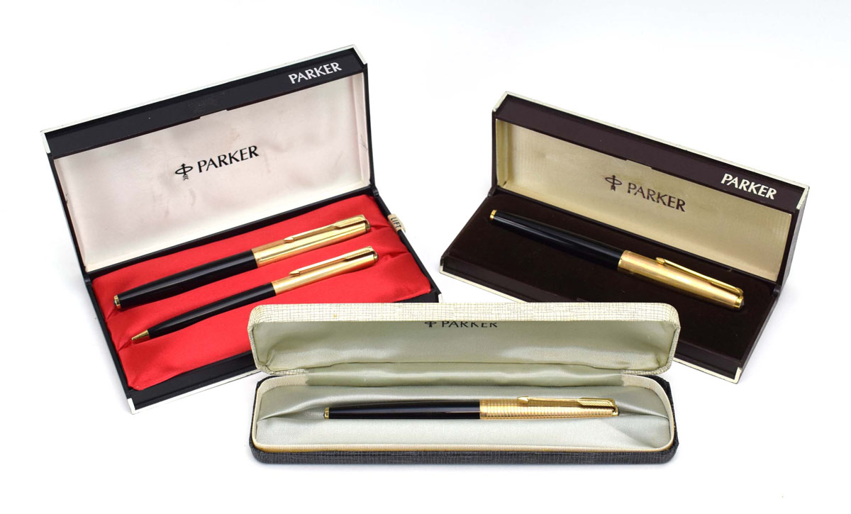 A cased Parker pen and pencil set with a 14ct gold nib,