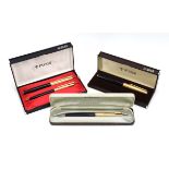 A cased Parker pen and pencil set with a 14ct gold nib,