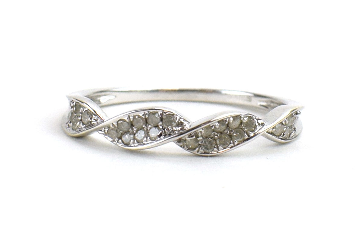 A 9ct white gold ring set small diamonds in a twist setting by Jacques Christie, ring size S, 2.