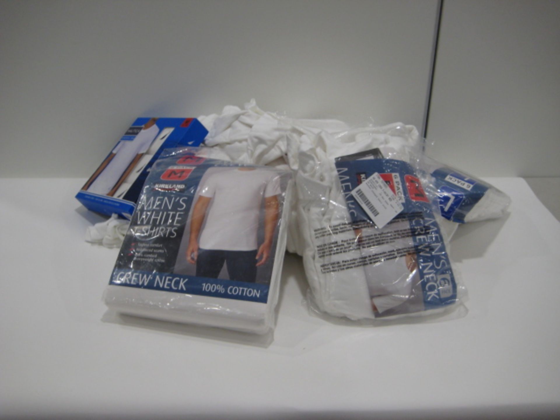 Bag containing Kirkland and Nautica gents white t-shirts, sizes ranging from M - L