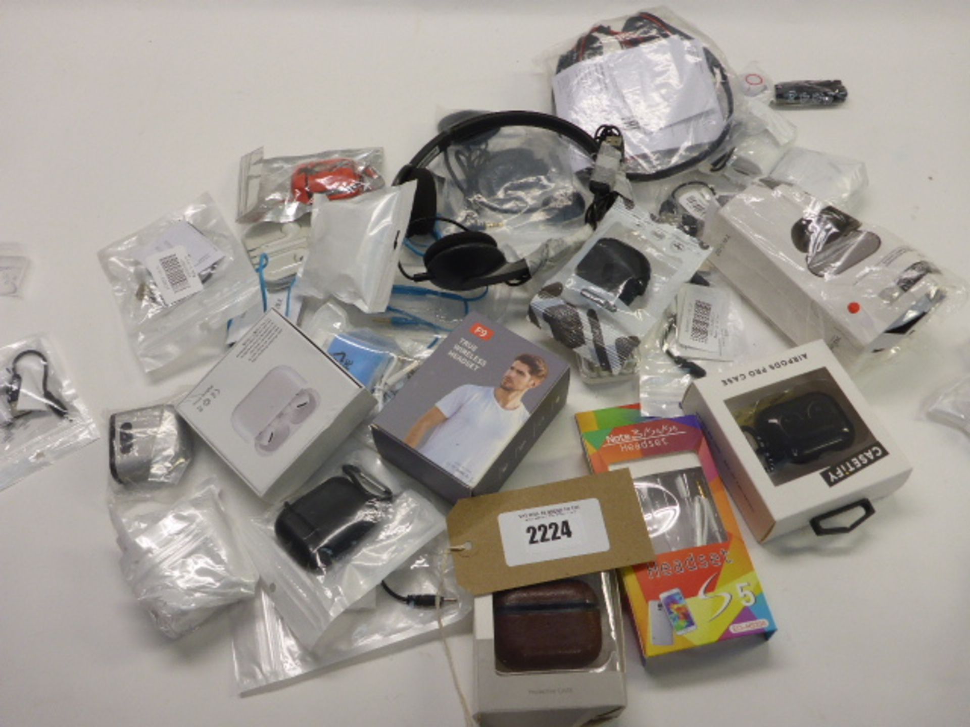 Bag containing quantity of wireless earphones, earphone accessories and headsets