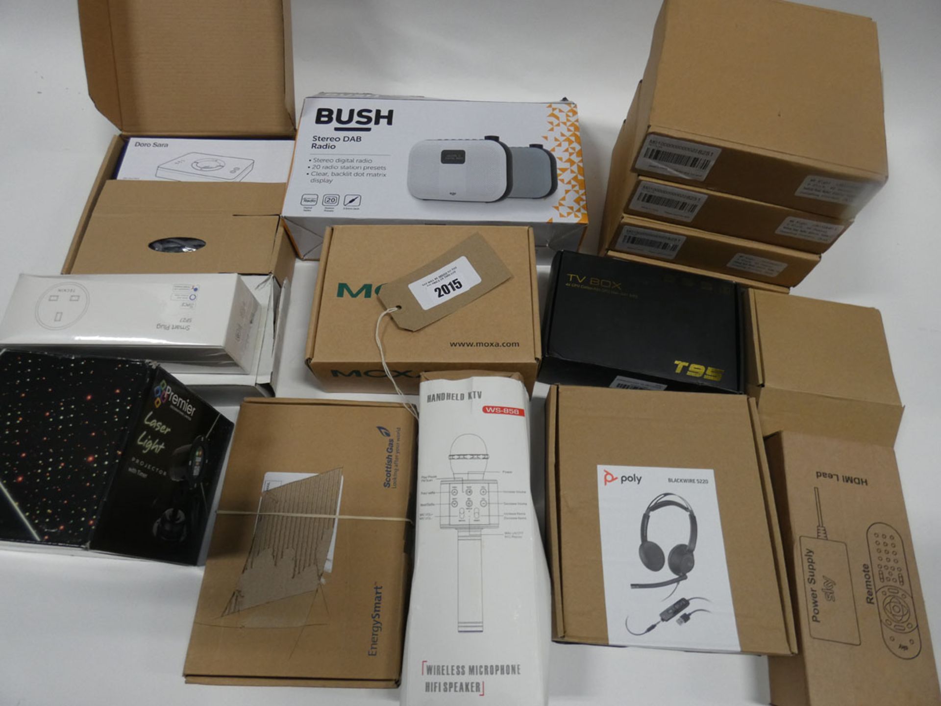 Bag containing Poly headset, Bush DAB radio, LED strip lights, outdoor/indoor lazer, android TV box,