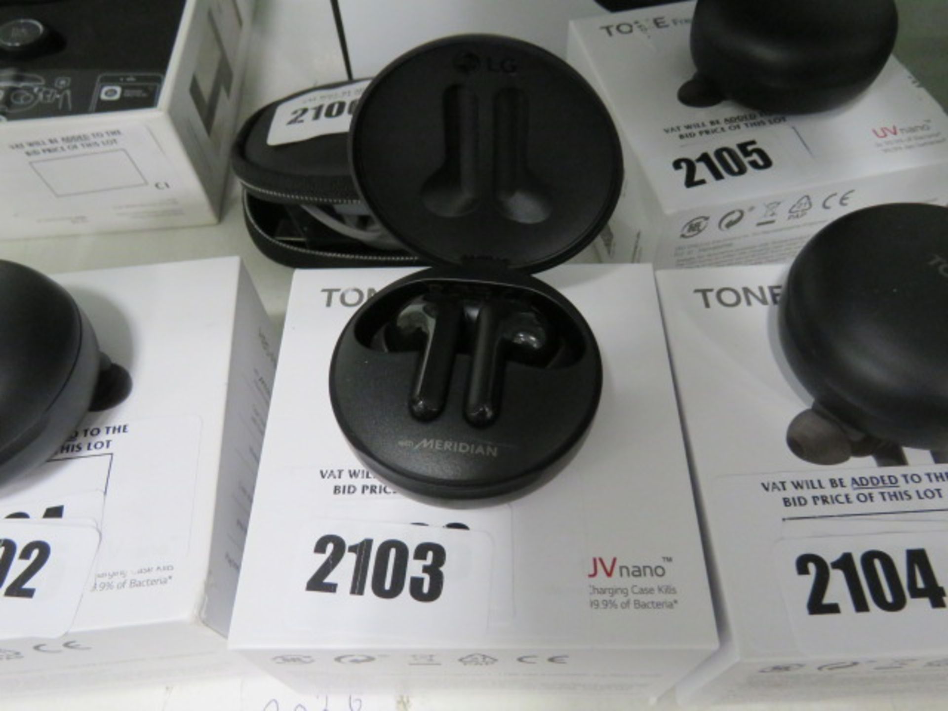 2086 - LG UV Nano wireless earbuds with charging case and box