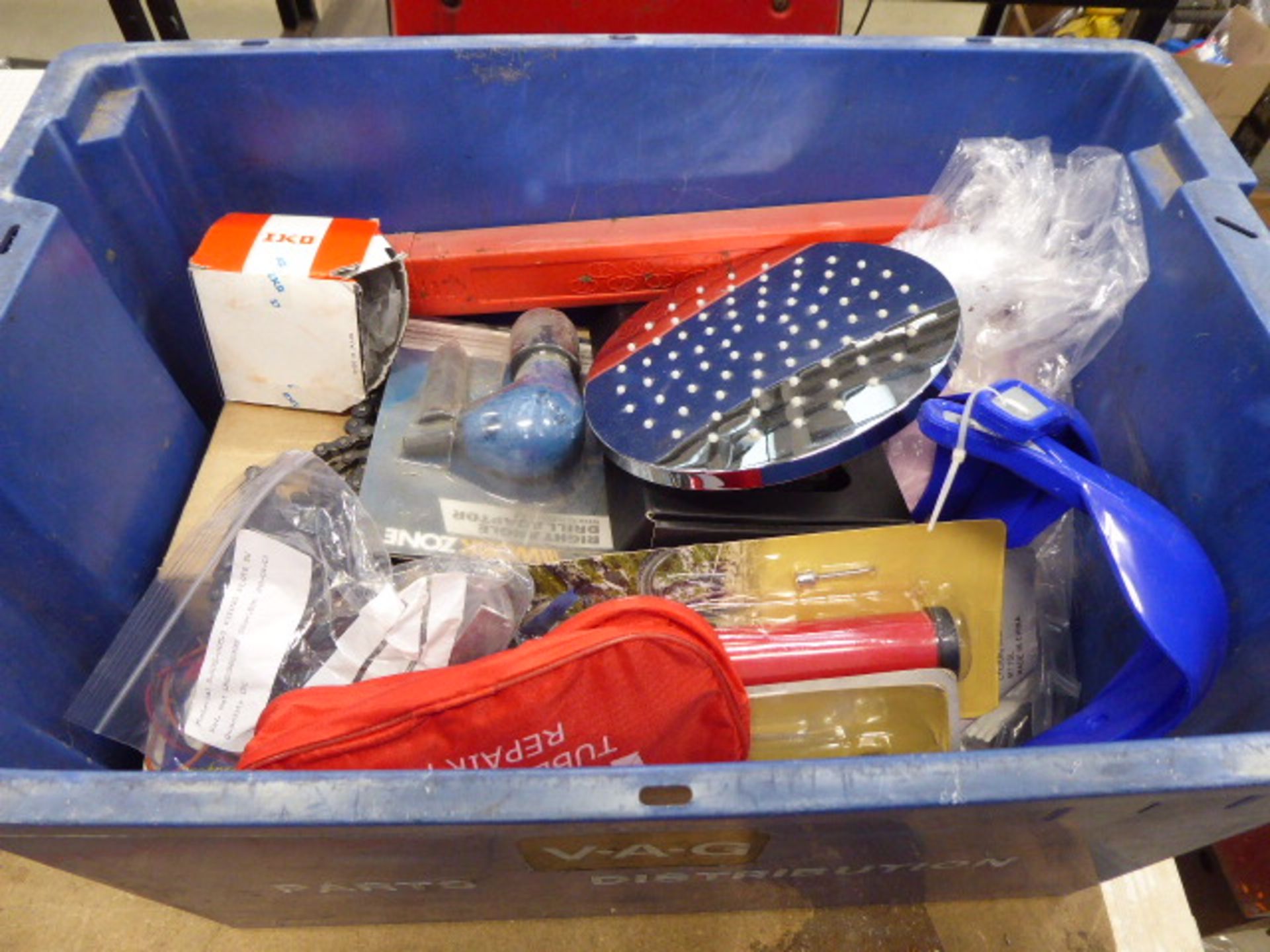 Large plastic blue box containing bike pumps, shower heads, pedals, drill adaptors, etc