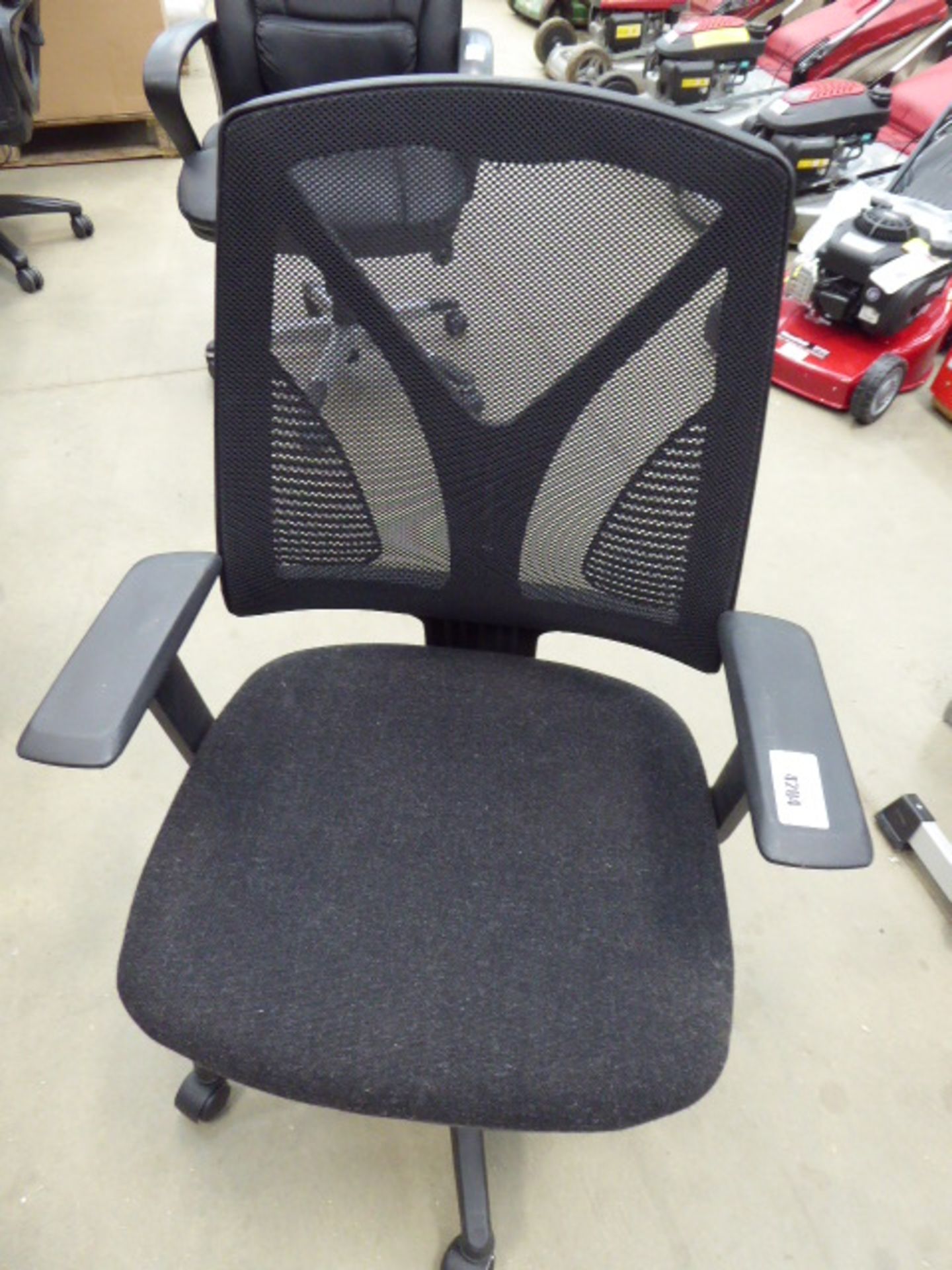 Black cloth mesh back swivel armchair