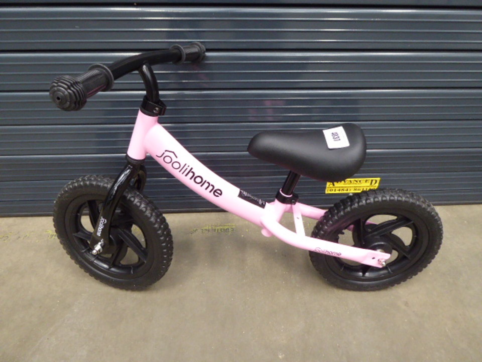 Small childs pink balance bike