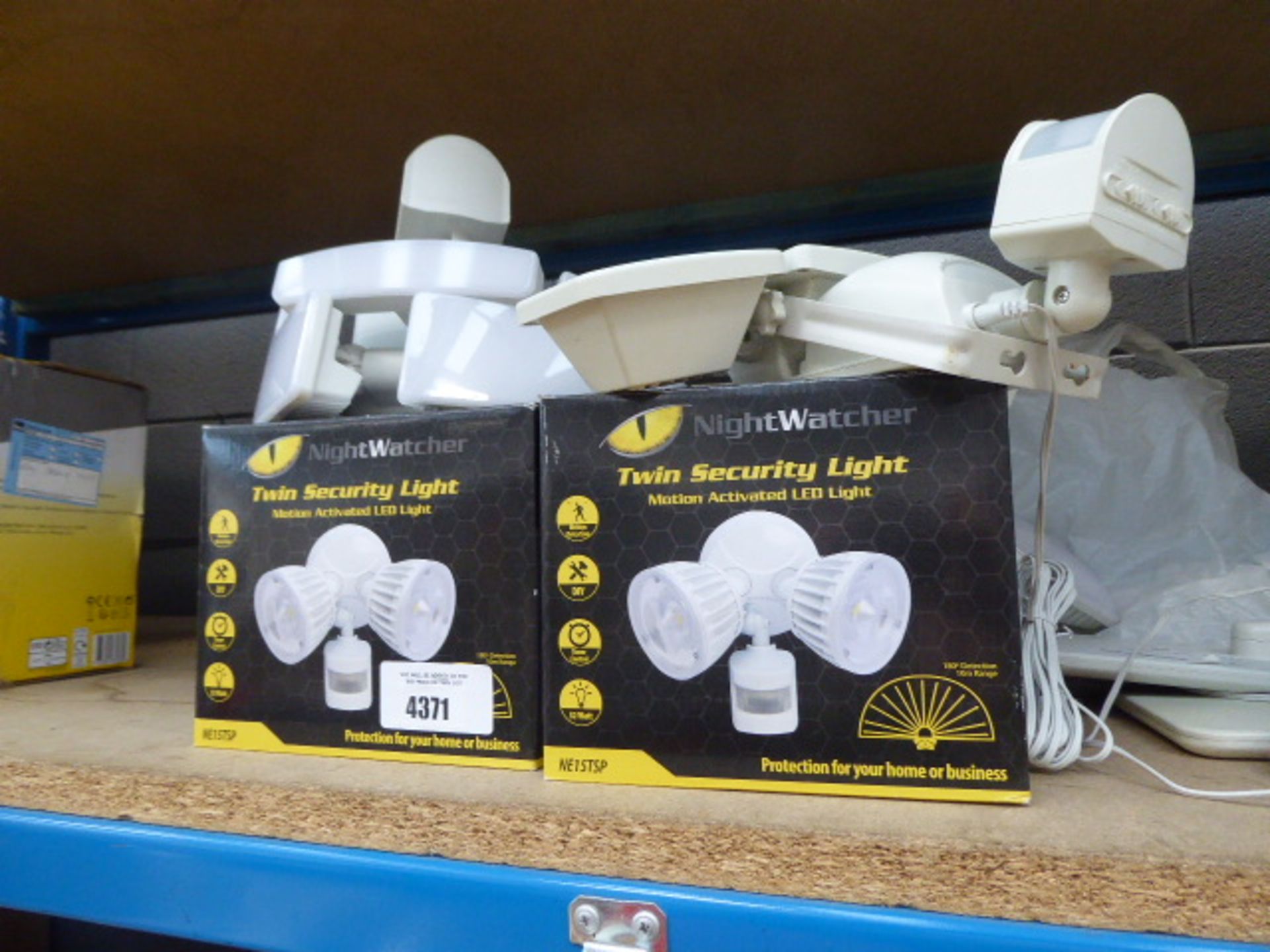 2 boxed and 3 unboxed Nightwatcher security lights